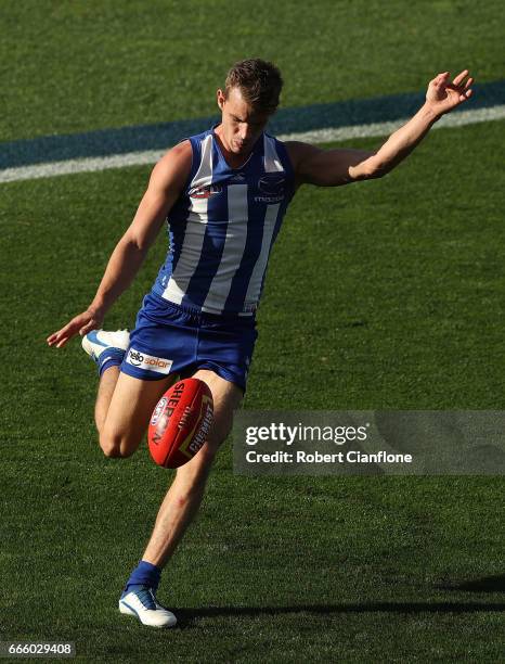 Sam Durdin of the Kangaroos kicks the ball during the round three AFL match between the North Melbourne Kangaroos and the Greater Western Sydney...