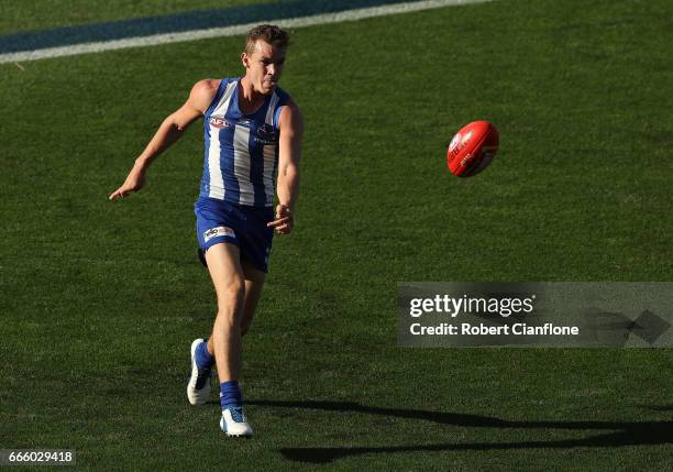 Sam Durdin of the Kangaroos kicks the ball during the round three AFL match between the North Melbourne Kangaroos and the Greater Western Sydney...