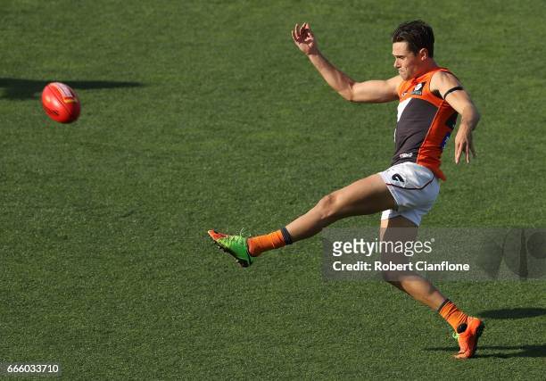 Josh Kelly of the Giants kicks the ball during the round three AFL match between the North Melbourne Kangaroos and the Greater Western Sydney Giants...