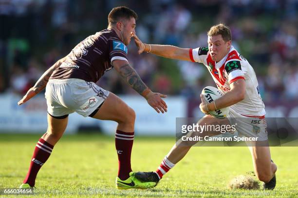 Kurt Mann of the Dragons is tackled during the round six NRL match between the Manly Sea Eagles and the St George Illawarra Dragons at Lottoland on...