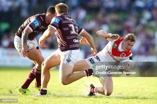 Kurt Mann of the Dragons is tackled during the round six NRL match between the Manly Sea Eagles and the St George Illawarra Dragons at Lottoland on...