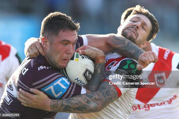 Curtis Sironen of the Sea Eagles is tackled during the round six NRL match between the Manly Sea Eagles and the St George Illawarra Dragons at...