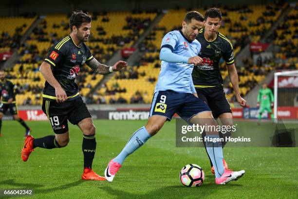 Bobo of Sydney FC evades the defense of Tom Doyle and Marco Rossi of the Phoenix during the round 26 A-League match between the Wellington Phoenix...