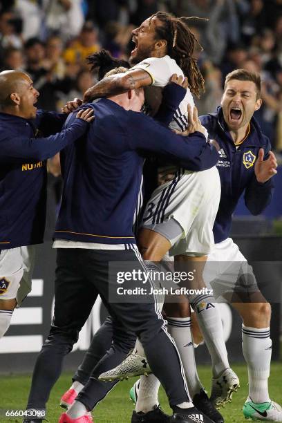 The Los Angeles Galaxy reacts after Jermaine Jones scores the second goal of the night during the Los Angeles Galaxy's MLS match against Montreal...
