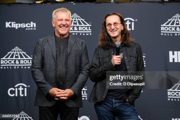 Presenters and 2013 Inductees Alex Lifeson and Geddy Lee of Rush attend the Press Room of the 32nd Annual Rock & Roll Hall of Fame Induction Ceremony...