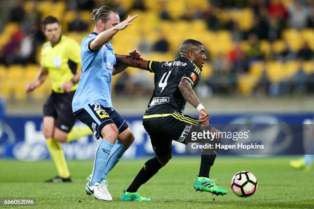 Roly Bonevacia of the Phoenix holds off the challenge of Rhyan Grant of Sydney FC during the round 26 A-League match between the Wellington Phoenix...