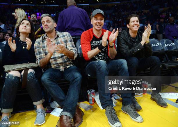 Actor Dax Shepard cheers for the Laker girls as they perform during the Sacramento Kings and Los Angeles Lakers basketball game at Staples Center...