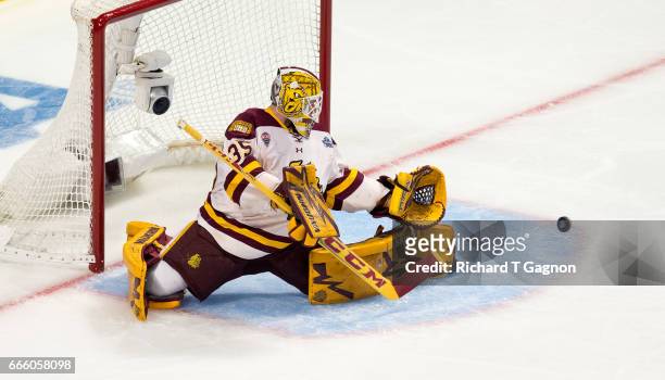 Hunter Miska of the Minnesota Duluth Bulldogs makes a save against the Harvard Crimson during game one of the 2017 NCAA Division I Men's Hockey...