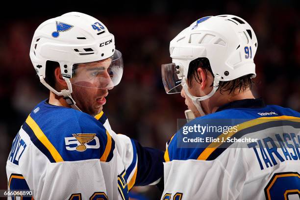 Jordan Schmaltz of the St. Louis Blues chats with teammate Vladimir Tarasenko during a break in the action against the Florida Panthers at the BB&T...