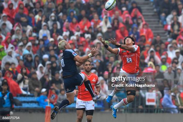 Tian Schoeman and Yoshitaka Tokunaga compete for the ball during the Super Rugby Rd 7 match between Sunwolves v Bulls at Prince Chichibu Memorial...