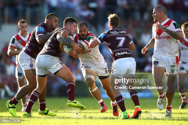 Leeson Ah Mau of the Dragons is tackled during the round six NRL match between the Manly Sea Eagles and the St George Illawarra Dragons at Lottoland...