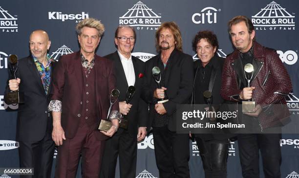 Inductees Steve Smith, Ross Valory, Aynsley Dunbar, Gregg Rolie, Neal Schon and Jonathan Cain of Journey attend the Press Room of the 32nd Annual...