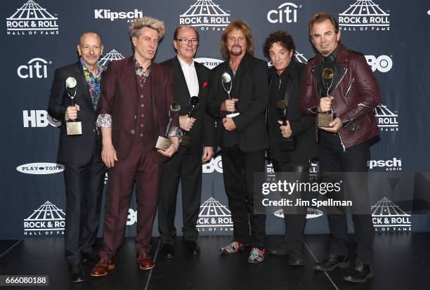 Inductees Steve Smith, Ross Valory, Aynsley Dunbar, Gregg Rolie, Neal Schon and Jonathan Cain of Journey attend the Press Room of the 32nd Annual...