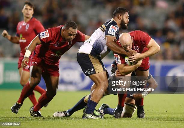 Stephen Moore of the Reds is tackled during the round seven Super Rugby match between the Brumbies and the Reds at GIO Stadium on April 8, 2017 in...