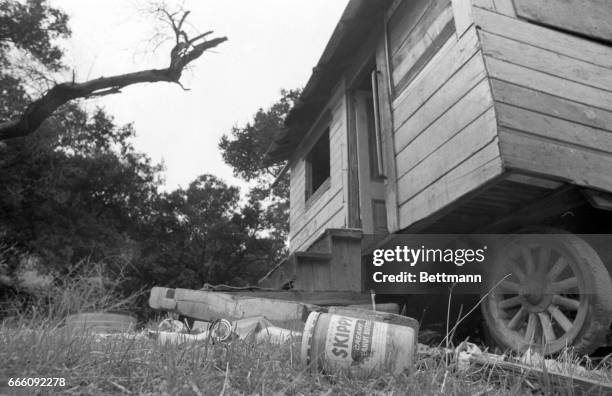 Empty food cans and jam jars litter the outside of one of the cabins in Spahn Ranch, a former movie ranch. It was here that a commune of hippie type...