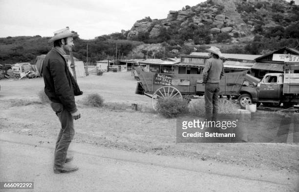 Mike Armstrong , foreman, and Larry Craven , assistant foreman of the Spawn Movie Ranch look over area in which three suspects, in the mass murder of...