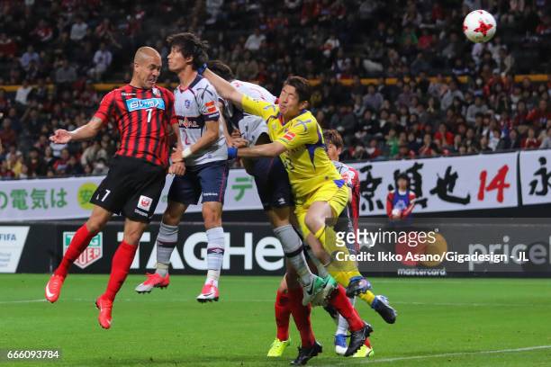 Julinho of Consadole Sapporo heads the ball to score his side's first goal during the J.League J1 match between Consadole Sapporo and FC Tokyo at...