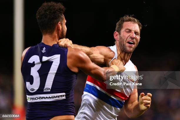 Michael Johnson of the Dockers and Travis Cloke of the Bulldogs wrestle during the round three AFL match between the Fremantle Dockers and the...