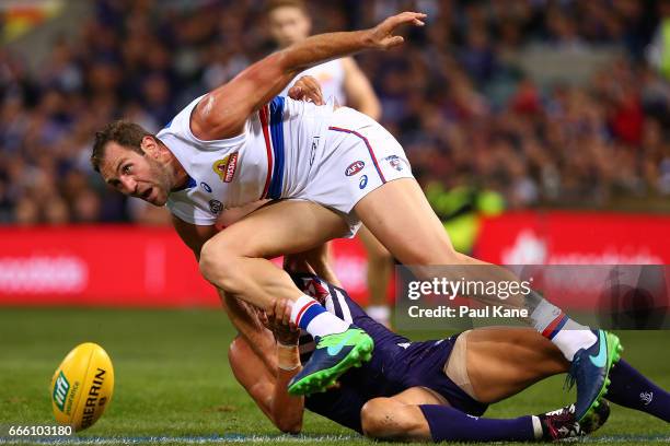 Travis Cloke of the Bulldogs contests for the ball against Michael Johnson of the Dockers during the round three AFL match between the Fremantle...
