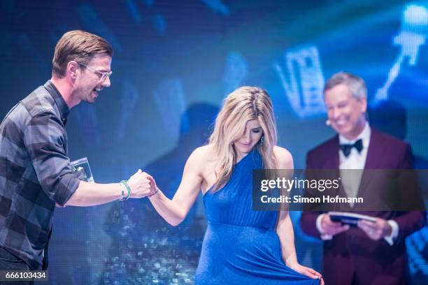 Joko Winterscheidt is awarded by Panagiota Petridou during the Radio Regenbogen Award 2017 at Europapark on April 7, 2017 in Rust, Germany.