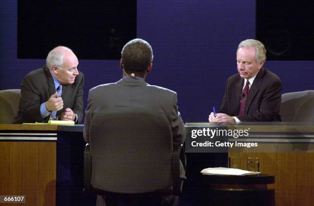 Left to right, Republican Vice Presidential canidate Dick Cheney, moderator Bernard Shaw, and Democratic Vice Presidential candidate Senator Joe...