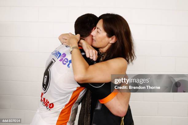 West Tigers Chairwomen, Marina Go hugs Mitchell Moses of the Tigers following the round six NRL match between the North Queensland Cowboys and the...