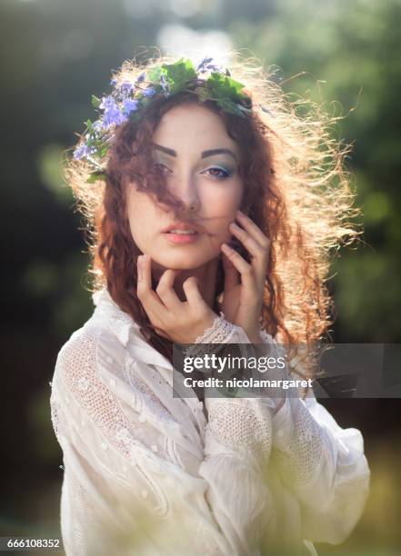 young woman with spring flowers - nicolamargaret stock pictures, royalty-free photos & images