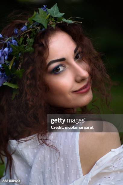 young woman with floral headdress - nicolamargaret stock pictures, royalty-free photos & images