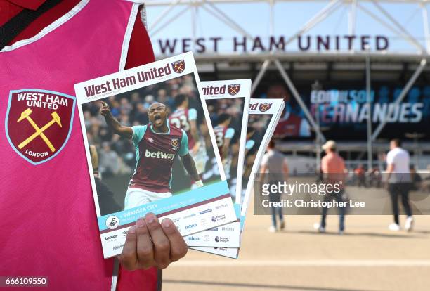 Match day programmes for sale are seen outside the stadium prior to the Premier League match between West Ham United and Swansea City at London...