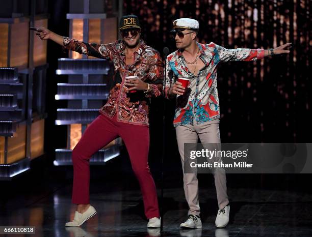 Recording artists and co-hosts Luke Bryan and Dierks Bentley speak during the 52nd Academy of Country Music Awards at T-Mobile Arena on April 2, 2017...