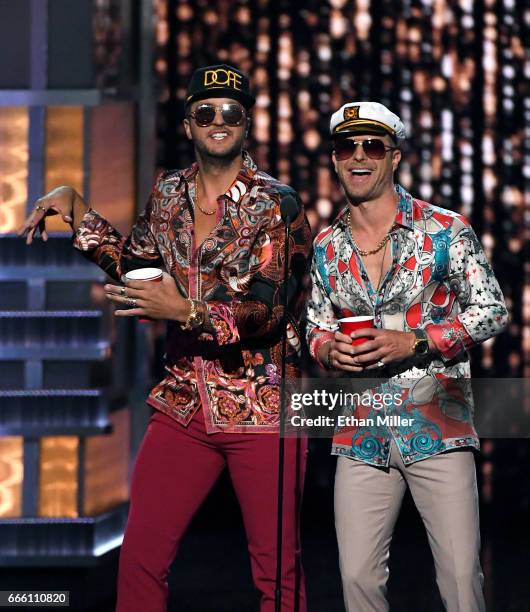 Recording artists and co-hosts Luke Bryan and Dierks Bentley speak during the 52nd Academy of Country Music Awards at T-Mobile Arena on April 2, 2017...