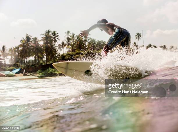 man surfing - kerala surf foto e immagini stock