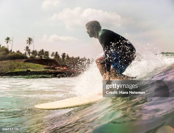 man surfing - kerala surf stock-fotos und bilder