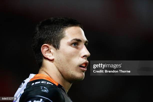 Mitchell Moses of the Tigers looks on during the round six NRL match between the North Queensland Cowboys and the Wests Tigers at 1300SMILES Stadium...