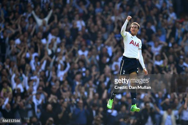 Dele Alli of Tottenham Hotspur celebrates scoring his sides first goal during the Premier League match between Tottenham Hotspur and Watford at White...