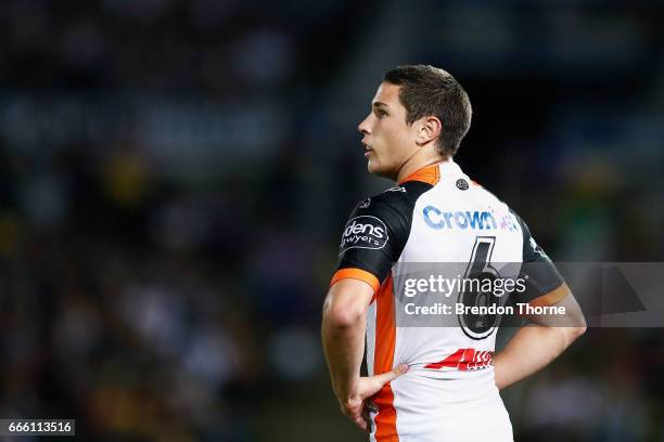 Mitchell Moses of the Tigers looks on during the round six NRL match between the North Queensland Cowboys and the Wests Tigers at 1300SMILES Stadium...