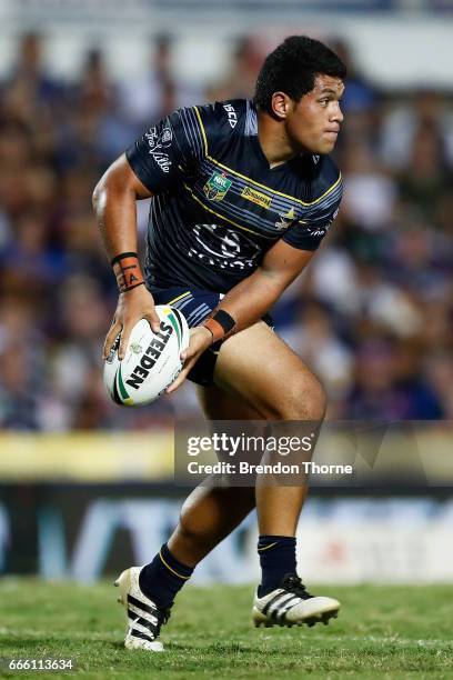 John Asiata of the Cowboys runs the ball during the round six NRL match between the North Queensland Cowboys and the Wests Tigers at 1300SMILES...