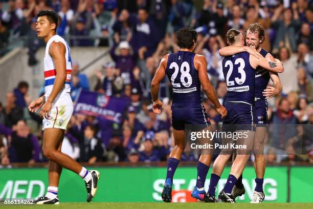 Cam McCarthy and David Mundy of the Dockers celebrate a goal during the round three AFL match between the Fremantle Dockers and the Western Bulldogs...