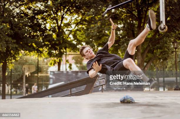 young adult riding scooter - fell stock pictures, royalty-free photos & images