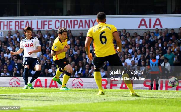 Heung-Min Son of Tottenham Hotspur scores his sides fourth goal during the Premier League match between Tottenham Hotspur and Watford at White Hart...