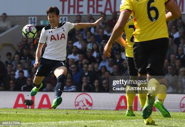 Tottenham Hotspur's South Korean striker Son Heung-Min prpepares to volley the ball to score his team's fourth, and his second goal during the...