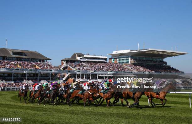 General view of horses and riders taking the first bend is seen during the Gaskells Handicap Hurdle Race at Aintree Racecourse on April 8, 2017 in...