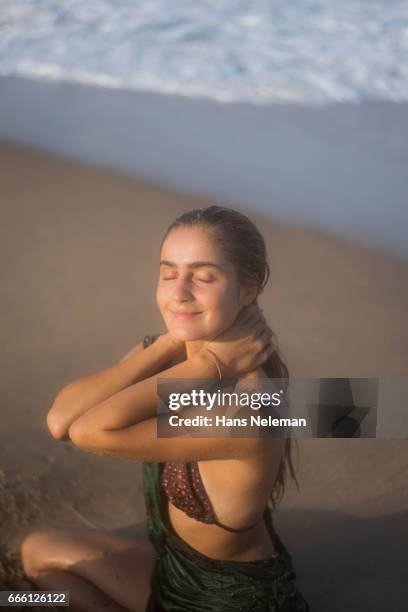 view of playful woman enjoying at beach - kerala surf stock pictures, royalty-free photos & images