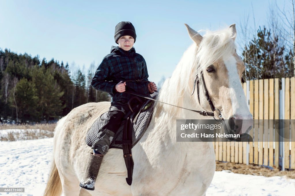 Boy Riding Horse High-Res Stock Photo - Getty Images