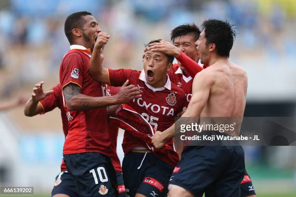 Ryuji Sugimoto of Nagoya Grampus celebrates scoring his side's second goal with his team mates during the J.League J2 match between Nagoya Grampus...