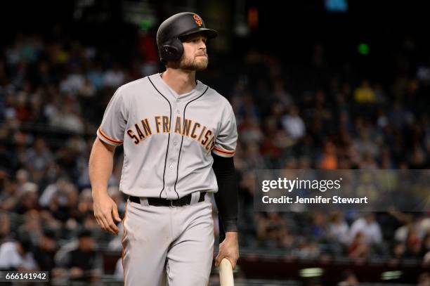 Conor Gillaspie of the San Francisco Giants reacts after striking out in the eighth inning against the Arizona Diamondbacks at Chase Field on April...