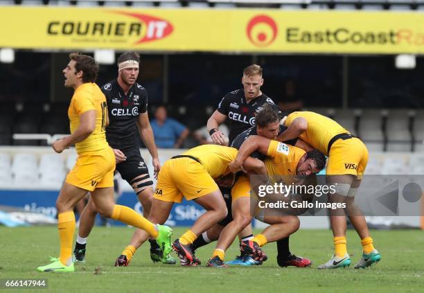Etienne Oosthuizen of the Cell C Sharks looks to tackle Agustin Creevy of the Jaguares during the Super Rugby match between Cell C Sharks and...