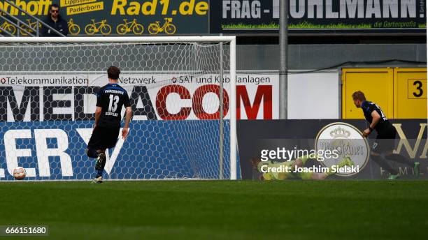 Marcus Piossek of Paderborn challenges Soeren Pirson of Frankfurt and shoot the Goal 2:0 during the third league match between SC Paderborn and FSV...