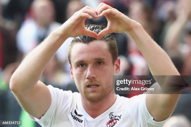 Christian Clemens of Koeln celebrates his team's first goal during the Bundesliga match between 1. FC Koeln and Borussia Moenchengladbach at...