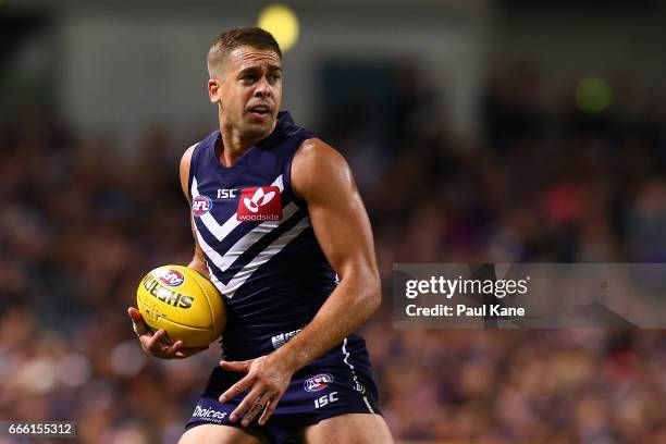 Stephen Hill of the Dockers looks to pass the ball during the round three AFL match between the Fremantle Dockers and the Western Bulldogs at Domain...